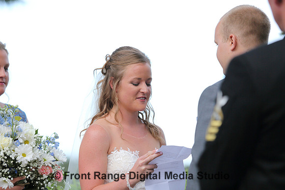 Reading her vows.