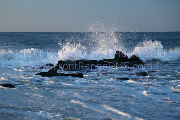 Water hitting rocks at the shore line